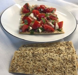 Flatbread crackers with caprese salad
